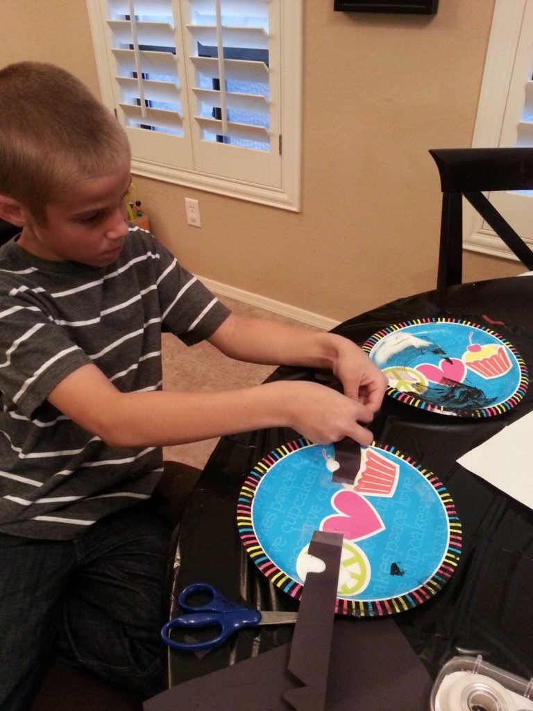 Celebrity Trainer Heidi Powell - Monster Masks - learn how to make these on http://heidipowell.net/?p=4029 Matix adding decorations to his monster mask http://heidipowell.net/4029